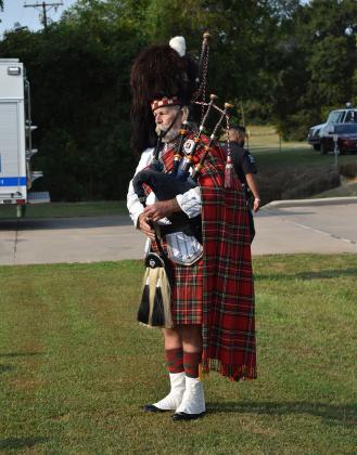 Lary Fowler plays the bagpipes.