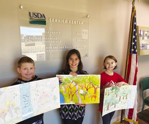 Como-Pickton fifith graders finishing in the to three in this year's poster contest are from left Trevor Thompson, Bryanna Neal and Courtney Collins. Hopkins-Rains Soil and Water Conservation District Photo