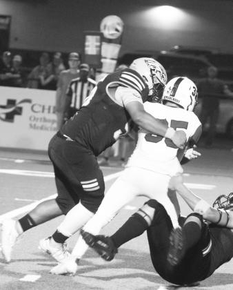 Como-Pickton's Jorge Garcia (56) records a tackle during a game against Rivercrest last season. Garcia was one of six Eagles named as a player to watch by Dave Campbell's Texas Football.