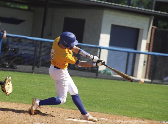 NICE CUT — Evan Moore (5) takes a big cut off of a pitch during a game against Caddo Mills this past season. Moore earned honorable mention all-district honors for his play on the diamond this season. Photo by DJ Spencer